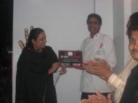 Neelu presents Ashtad with the certificate